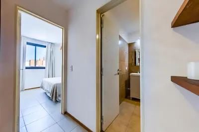 a large mirror in a room with a bedroom at La Rioja 1092 B Alberdi in Cordoba
