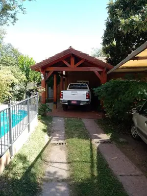 a white truck parked in a car garage at Cabañas Altos del Centro in Merlo