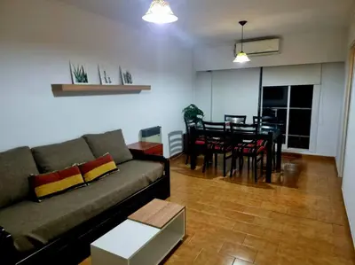 a living room with a couch and a table at Departamento 2 ambientes. 2 cuadras de Patio Olmos in Cordoba