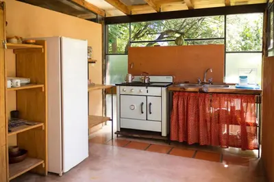 a kitchen with a white stove and a refrigerator at Las Rukas in San Javier