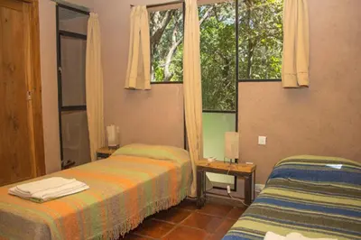 a hotel room with two beds and a window at Las Rukas in San Javier