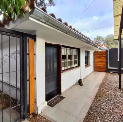 a house with a gate and a door at CASA TRANSFORMER in Cordoba