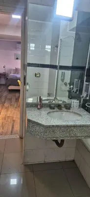 a bathroom with a sink and a mirror at Departamento NYC 2 - Edificio VILAUT by INMOVE Temporarios in Cordoba