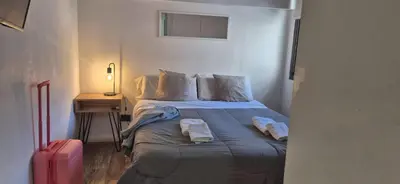 a bedroom with a bed with two towels on it at Departamento NYC 2 - Edificio VILAUT by INMOVE Temporarios in Cordoba