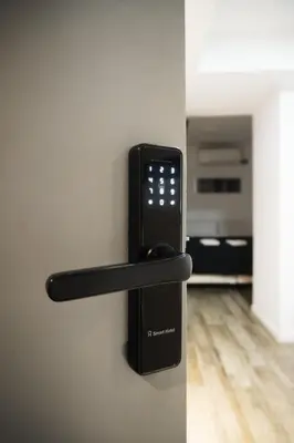 a black phone hanging on a wall at Departamento NYC 2 - Edificio VILAUT by INMOVE Temporarios in Cordoba