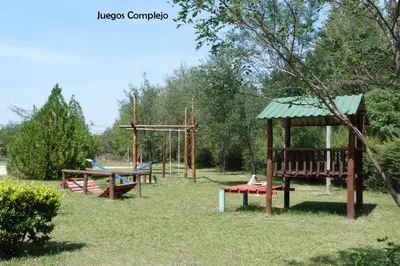 a park with two swings and a playground at Yerba Buena casas de campo - Arroyo de los Patos in Nono