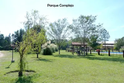 a park with a picnic pavilion in the grass at Yerba Buena casas de campo - Arroyo de los Patos in Nono