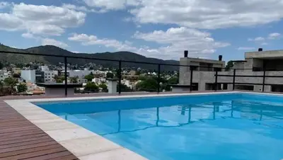 a large swimming pool on top of a building at Paseo Quattro Villa Carlos Paz in Villa Carlos Paz