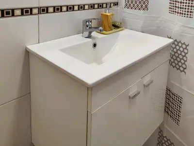 a bathroom with a white sink in a room at Casa Nuup in Río Tercero