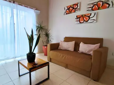 a living room with a couch and a table at Casa Nuup in Río Tercero