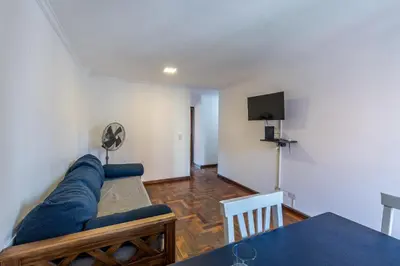 a living room with a couch and a table at Alójate en la Docta by Lofty in Cordoba