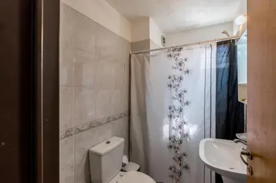 a bathroom with a toilet and a sink at Alójate en la Docta by Lofty in Cordoba