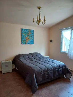 a bedroom with a large bed in a room at Villa Somena in Tanti