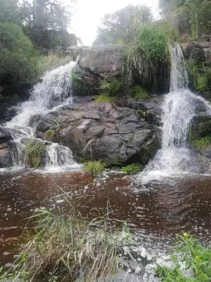 a waterfall on the side of a river at Villa Somena in Tanti