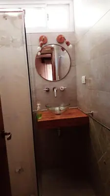 a bathroom with a sink and a mirror at Casa Maravilla in Villa Carlos Paz