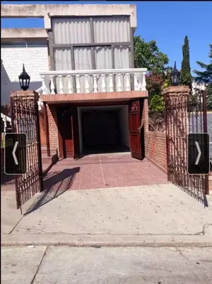 a entrance to a building with a gate at Casa Maravilla in Villa Carlos Paz
