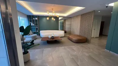 a living room with a bed and a table at Guesthouse Park in Cordoba