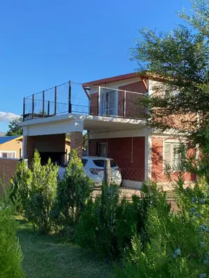a house with a balcony on top of it at El Rincon de las Marias in San Lorenzo