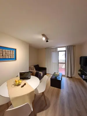 a living room with a table and a couch at Tu lugar en Nueva Córdoba!A 50 mtros del Sanatorio Acongagua in Cordoba