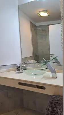 a bathroom with a sink and a large mirror at ESPACIO C CRISOL Plaza España in Cordoba