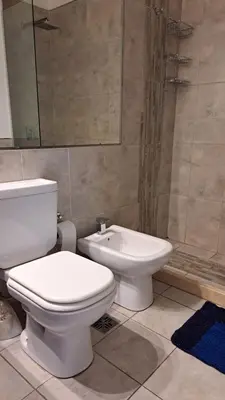 a bathroom with a toilet and a bidet at ESPACIO C CRISOL Plaza España in Cordoba