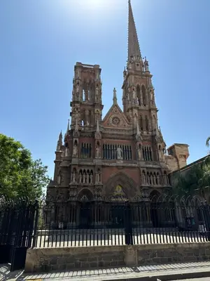 a large building with a fence in front of it at Departamento premium, la mejor zona de Nueva Córdoba in Cordoba