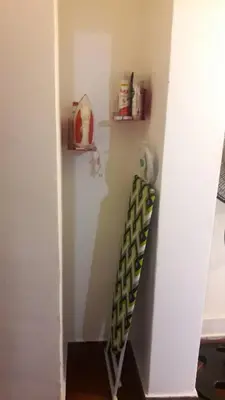 a stairwell in a room with a ladder and a shelf at Departamento Córdoba in Cordoba