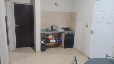a small kitchen with a sink and a stove at Cabaña el Torreon in San Ignacio