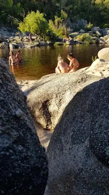 a group of naked people sitting in the water at Las Lavandas Tranquilidad cerca de todo in Mina Clavero