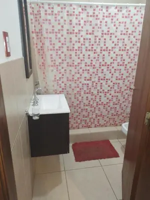 a bathroom with a shower with a sink and a toilet at Cabaña Corcovado in El Parador