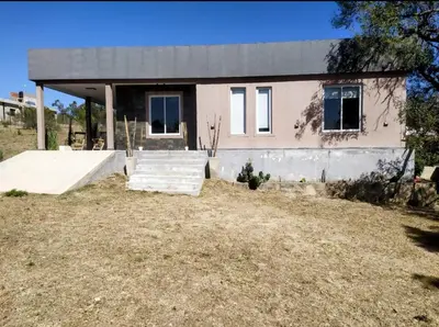 a house with a skateboard ramp in front of it at Amanecer serrano in Tanti