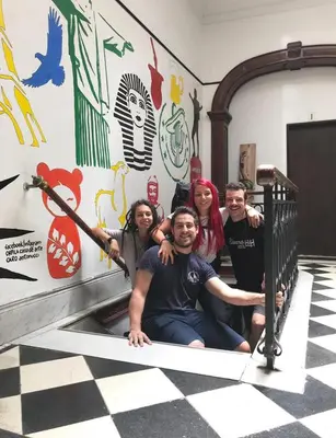 a group of people posing for a picture on a staircase at Rivera Hostel Córdoba in Cordoba
