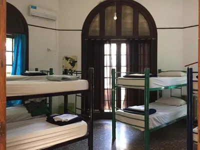 a group of bunk beds in a room at Rivera Hostel Córdoba in Cordoba
