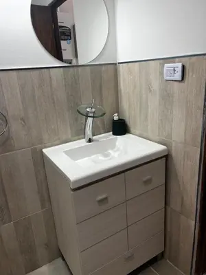 a bathroom with a sink and a mirror at Hermoso departamento in Villa Carlos Paz