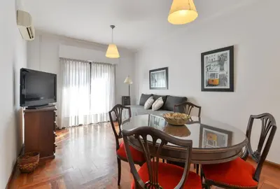 a living room with a table and a couch at Concord Rent Apart in Cordoba