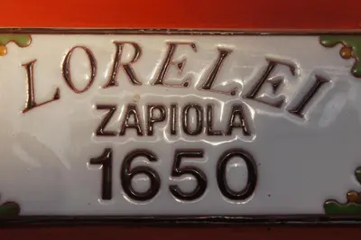 a white license plate with the words karachi zaria at Lorelei in Mina Clavero
