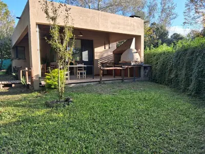 a house with a garden in front of it at La Llilda in La Bolsa