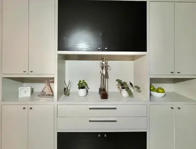 a kitchen with white cabinets and a counter top at Deluxe Nueva Córdoba - Premium Balcón & Asador in Cordoba