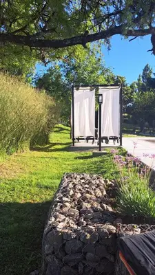 a gate in a park with a stone walkway at Aldea Mate Amargo in Potrero de Garay