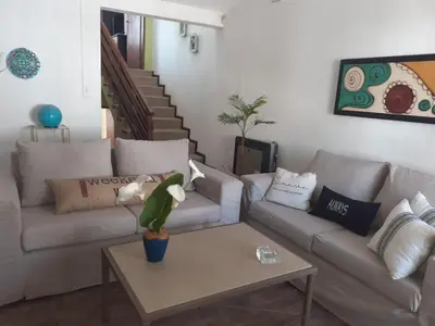 a living room with two couches and a coffee table at Loma del Alto in Alta Gracia