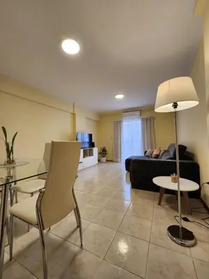 a living room with a couch and a table at Obispo Oro 451 - Nueva Córdoba in Cordoba
