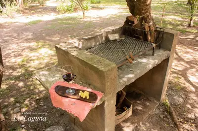a concrete structure with a bowl on top of it at La Laguna - Cabañas de Troncos in Merlo