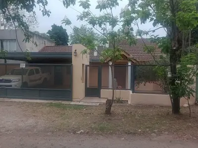 a house with a car parked in front of it at Casa 3 Habitaciones, 2 baños pileta a compartir con el anfitrion - in Cordoba