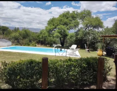 a swimming pool with a slide in a yard at Casa Del Arroyo in Arroyo de Los Patos