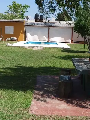 a view of a yard with a swimming pool at Casa Arenales in Almafuerte