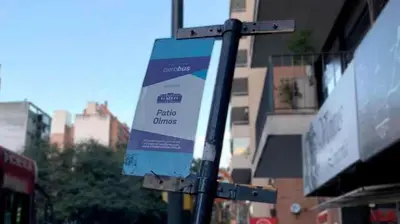 a street sign on a pole on a city street at Pilsen II Guemes in Cordoba