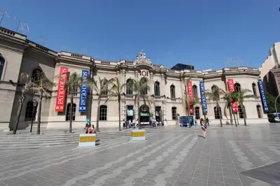 a large building with people walking in front of it at Pilsen II Guemes in Cordoba