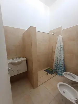 a bathroom with a sink and a toilet and a shower at Casa Villa Rumipal in Villa Rumipal