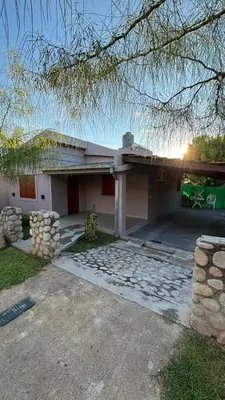 a large house with a driveway in front of it at Casa Familia Reynoso in Mina Clavero