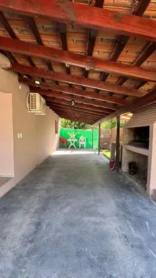 an empty garage with a wooden ceiling at Casa Familia Reynoso in Mina Clavero